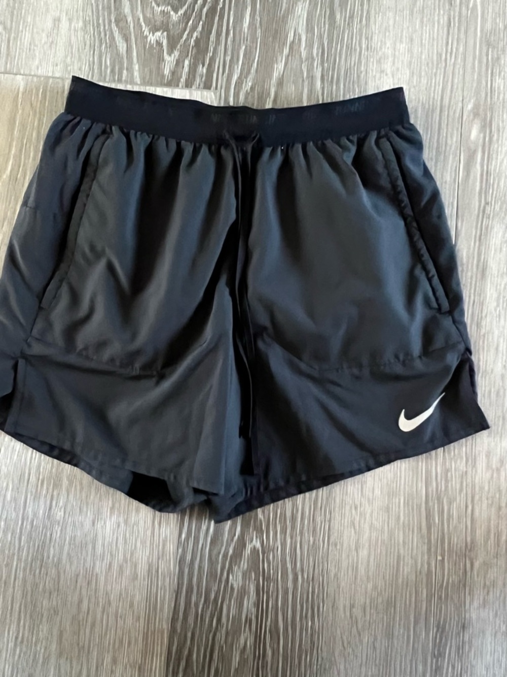 Nike Black Athletic Shorts with White Swoosh Logo